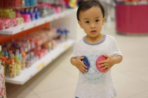 Child holding toys - Home Tuition Hotspot Singapore