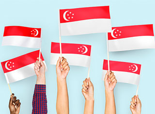 People holding the flag of Singapore