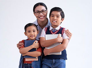 Singapore Home Tutor posing and smiling with two kids